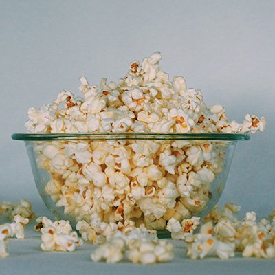 A bowl of popcorn, overflowing